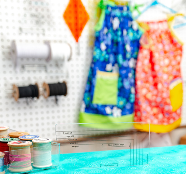 Pillowcase Dress Armhole Template in sewing room with pillowcase dresses